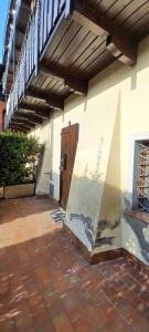 a building with a staircase and a porch with a patio at Re Di Coppe in Torre Boldone