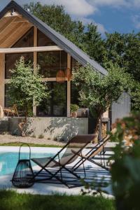 a house with a swimming pool in the yard at Villa Lis in Ivano-Frankivsk