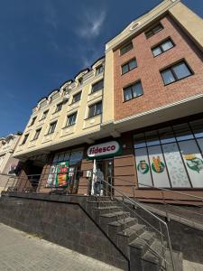 a building with a cisco sign in front of it at Modern cozy apartment ultracentral in Chişinău