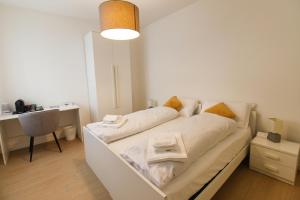 En eller flere senge i et værelse på Villa Lucchetta - Tre Camere e Appartamento con parcheggio Interno