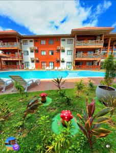 Swimmingpoolen hos eller tæt på Flat Vila Atlântida 311B