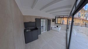 a view of a room with a television in a building at Luxury Home Airport in Naples