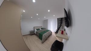 a bedroom with a bed and a mirror at Luxury Home Airport in Naples