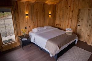 En eller flere senge i et værelse på Ecohotel Mauka + 7 billeder