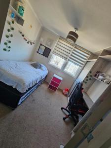 Postel nebo postele na pokoji v ubytování Cómodo departamento