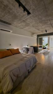 En eller flere senge i et værelse på Quartier Retiro Vista al Rio Piso 10