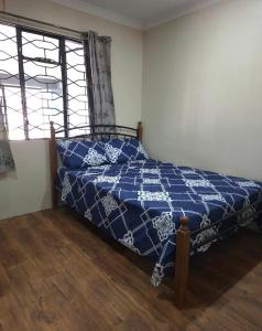 Postel nebo postele na pokoji v ubytování ZEG Homestay