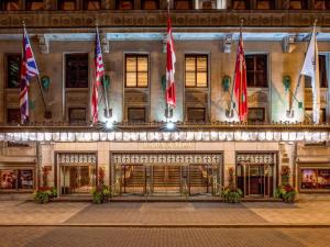a building with flags on the front of it at Fairmont Royal York Hotel in Toronto