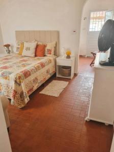 En eller flere senge i et værelse på Casa da Bisa Ubatuba