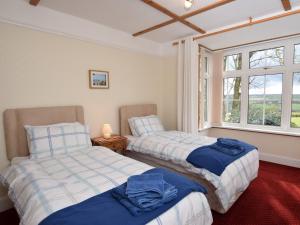 En eller flere senge i et værelse på 3 Bed in Bideford BYBUR