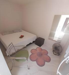 Giường trong phòng chung tại Pé na areia Búzios Geribá 1