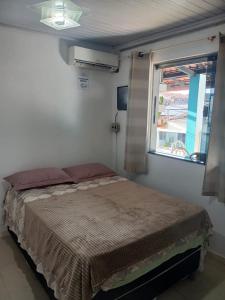 En eller flere senge i et værelse på Brisa Tropical