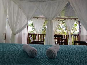 Ένα ή περισσότερα κρεβάτια σε δωμάτιο στο Donde se Oculta el Sol