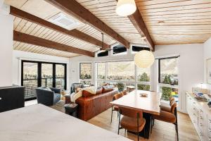 a living room with a couch and a table at Shadow Mountain 20 in Aspen