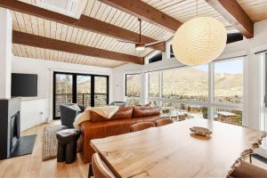 a living room with a couch and a table at Shadow Mountain 20 in Aspen +41 photos