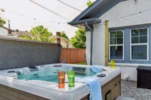 a hot tub in the backyard of a house at 5 Beds Downtown OKC - Pickleball, Hot Tub, Firepit, GameRoom in Oklahoma City