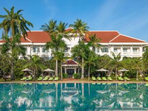 a resort with a pool in front of it at Raffles Grand Hotel d'Angkor in Siem Reap