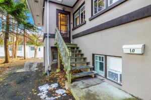 een huis met een trap naar een deur bij Midstream Premier 2BR Wi-Fi Parking in St. John's