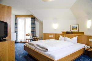 Postel nebo postele na pokoji v ubytování Hotel Idhof