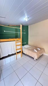 Ένα ή περισσότερα κρεβάτια σε δωμάτιο στο Pousada pipa meu amor