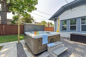 a hot tub in the backyard of a house at 5 Beds Downtown OKC - Pickleball, Hot Tub, Firepit, GameRoom in Oklahoma City