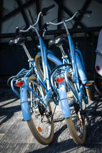 two blue bikes are parked next to each other at Hôtel Ar Iniz in Saint Malo