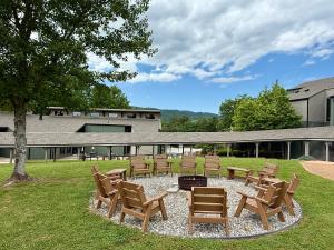 a group of chairs and a fire pit in a yard at Unicoi State Park & Lodge in Helen