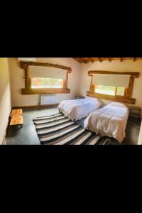 Postel nebo postele na pokoji v ubytování Cabaña Lago Puelo