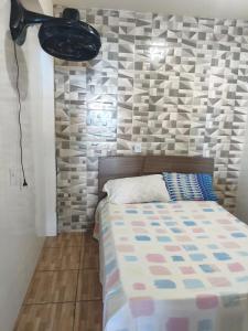 En eller flere senge i et værelse på Casa com piscina próxima ao centro de eventos Marisol + 12 billeder