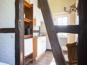 a kitchen with white cabinets and a counter top at Großbauernhaus in Bentwisch