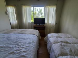 Ένα ή περισσότερα κρεβάτια σε δωμάτιο στο Mini cabaña acogedora en entorno natural