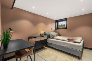 En eller flere senge i et værelse på Grand Junior Suite