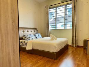 En eller flere senge i et værelse på Luxury Landed House - Vivacity Megamall