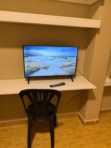 TV a/nebo společenská místnost v ubytování Apart Centro CDE + 18 fotografií