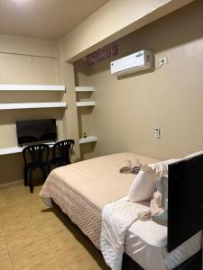 Postel nebo postele na pokoji v ubytování Apart Centro CDE