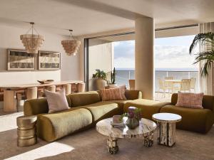 a living room with a couch and a table at Mondrian Gold Coast in Gold Coast +200 photos