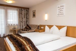 Postel nebo postele na pokoji v ubytování Hotel Idhof