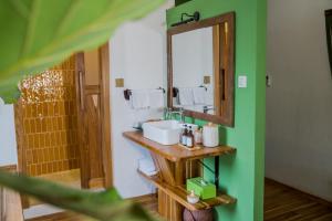 a bathroom with a sink and a mirror at Baan Samsa in Luang Prabang +128 photos