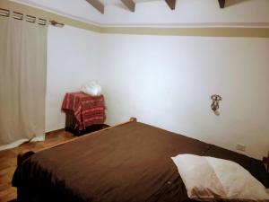 Ένα ή περισσότερα κρεβάτια σε δωμάτιο στο Wasi