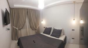 En eller flere senge i et værelse på Cocon & Confort