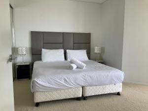 En eller flere senge i et værelse på Brisbane CBD/Firework/River view + 21 billeder