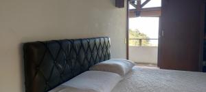 En eller flere senge i et værelse på Casa Vista Mar