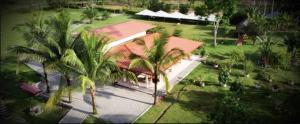 an aerial view of a house with palm trees at The Jungle Cocoon in Nueva Loja