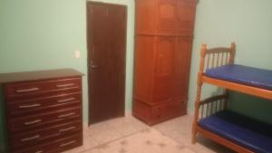 En eller flere senge i et værelse på espaço de festa do Filipe + 3 billeder