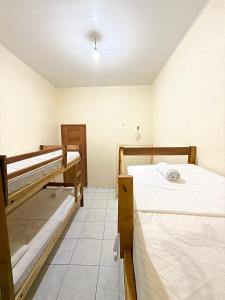 Postel nebo postele na pokoji v ubytování Hostel Solar da Pérola