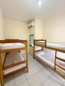 Postel nebo postele na pokoji v ubytování Hostel Solar da Pérola