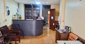 a lobby with a bar in the middle of a room at Victoria Hotel in Hua Hin