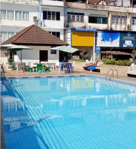 a large swimming pool in front of a building at Victoria Hotel in Hua Hin