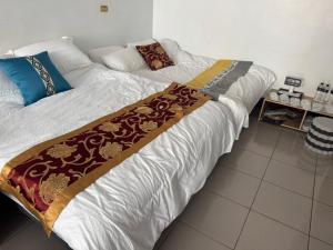 En eller flere senge i et værelse på Lukang Hongyu Hostel