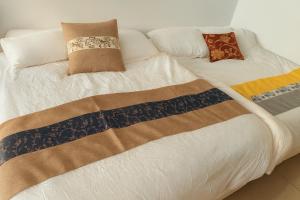 En eller flere senge i et værelse på Lukang Hongyu Hostel